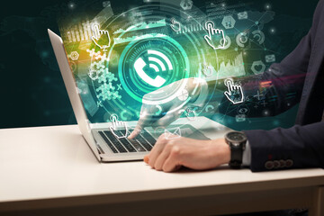 Business hand typing on a modern laptop