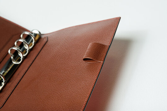 A personal organizer made of leather.