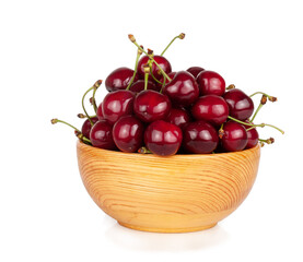 Sweet cherry in wooden cup isolated on a white background