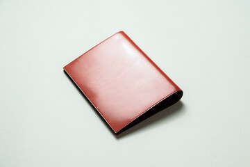A personal organizer made of leather.