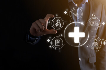 Businessman hold virtual plus medical network connection icons. Covid-19 pandemic develop people awareness and spread attention on their healthcare.Doctor,document,medicine,ambulance,patient icon.
