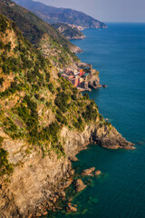 Beautiful coastline of Cinque Terre with the Vernazza town by the Ligurian Sea, Italy