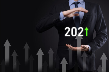 Business development to success and growing growth year 2021 concept.Plan business growth graph in year 2021 concept.Businessman plan and increase of positive indicators in his business