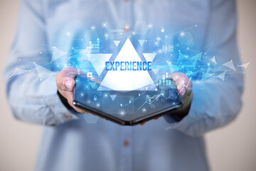 Businessman holding a foldable smartphone, business concept