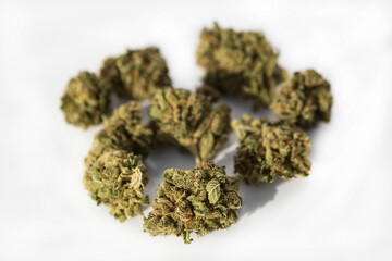 Marijuana pieces on isolated white background