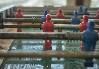 Detail of the red kicker. Football table