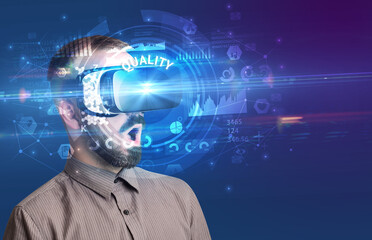 Businessman looking through VR glasses