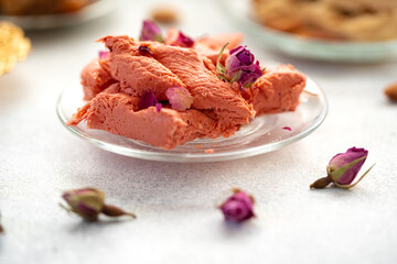 Close up of colorful Turkish halva sweets on gray surface