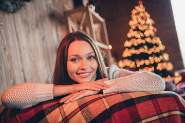 Fototapeta premium Photo of cute adorable young woman dressed knitted sweater relaxing smiling indoors room home house