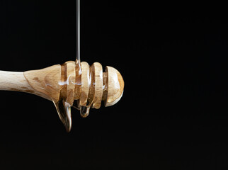 honey dripping from a stick