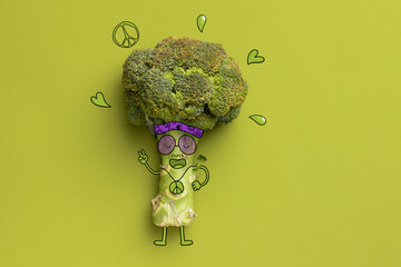 Contemporary art collage of funny hipster broccoli isolated over green background. Drawn doddles on...