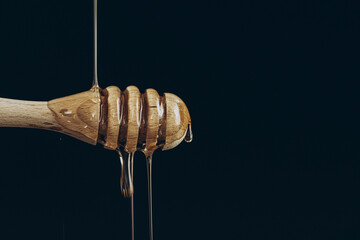 honey dripping from a spoon