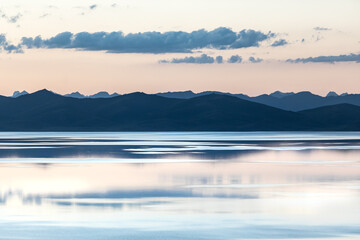 sunset shore of calm mountain lake. High quality photo