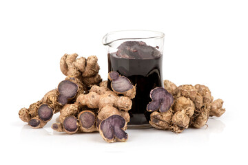 Black galingale rhizome and extracted isolated on white background.