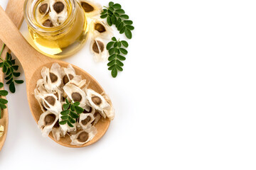Moringa and oil isolated on white background.top view,flat lay.