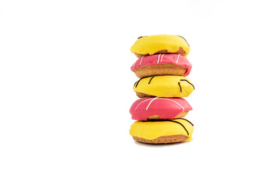 donuts isolated on white background. bright yellow and pink colors. bright and tasty food. NATIONAL DONUT DAY.delicious life. side view.


