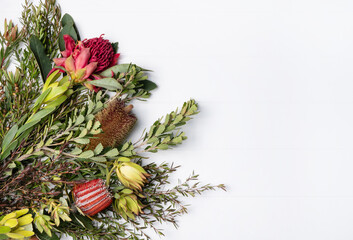 Beautiful flat lay floral arrangement of mostly Australian native flowers, including Purple and Red...