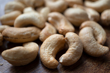 Tasty cashew nuts as background, top view