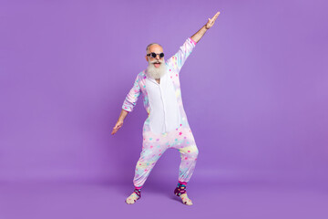 Full length body size view of attractive cheerful funny man in pajama having fun chill out isolated...