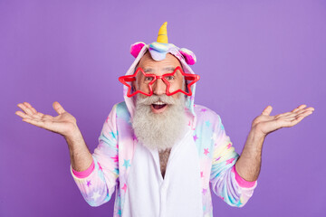 Portrait of attractive cheerful funny man in pajama good news reaction isolated over violet purple color background © deagreez