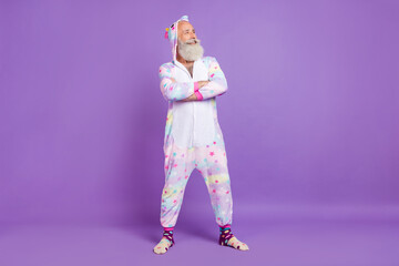 Full body photo of cheerful confident old man wear nightwear look empty space hands crossed...