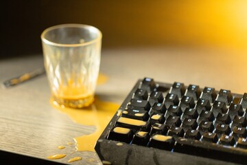 Coffee spilled on mechanical keyboard of computer