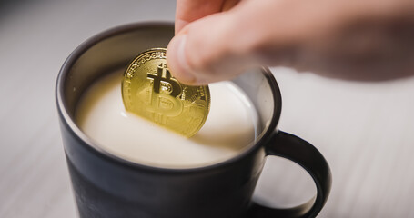 Buy the dip footage of dipping bitcoin into milk - obrazy, fototapety, plakaty