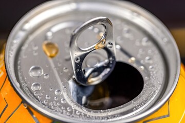 Opening soda can in slow motion closeup