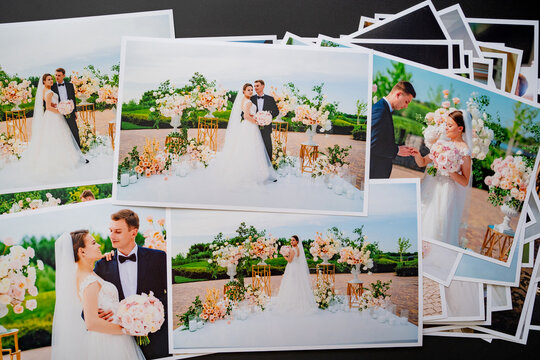 spread out wedding photos. result of photographer's work at wedding ceremony