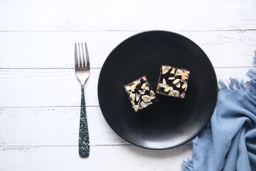 slice of brownie on plate on table 