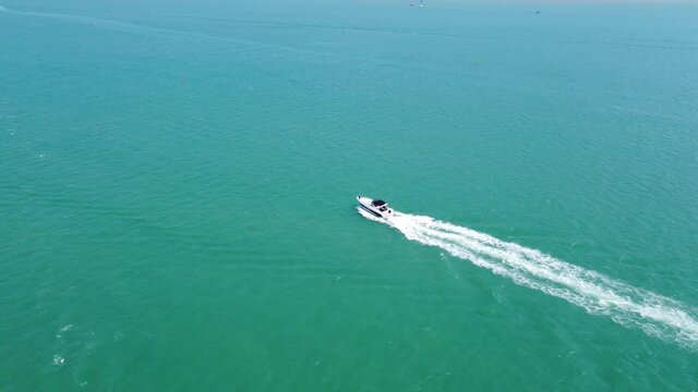 Aerial view of  a speedboat in the atlantic ocean in Paraty - Rio de Janeiro, Brazil