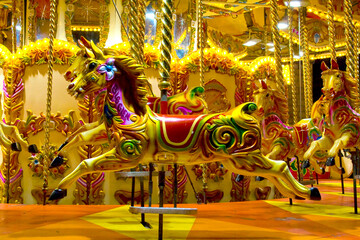 horses on a Merry go round in a fairground