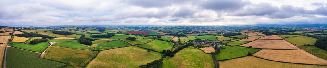 Panorama of fields from drone, Berry Pomeroy Village, Devon, England, Europe