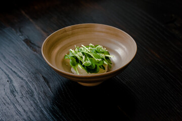 Dish of cottage cheese and garden greens with flowers made at a restaurant