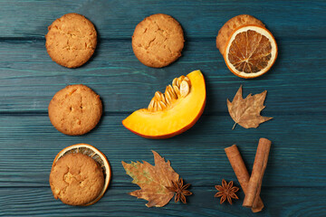 Obraz na płótnie Canvas Pumpkin cookies on blue wooden background, top view