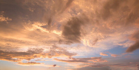 bright sunset scenery with yellow and orange shiny clouds