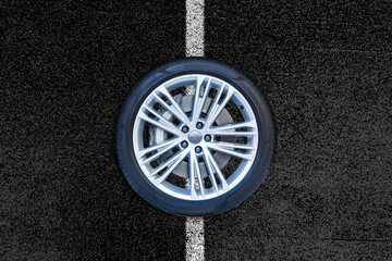 Car wheels isolated on a road background.
