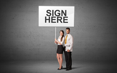 business person holding a traffic sign