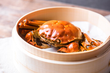 Chinese hairy crabs in bamboo steamer, chinese cuisine