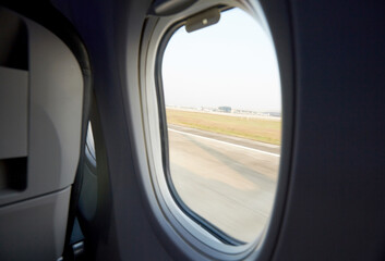 Close-up airplane cabin window during the journey