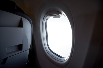 Close-up airplane cabin window during the journey