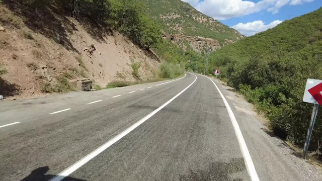 Forest asphalt road with next to Munzur River - Ovacik, Tunceli 