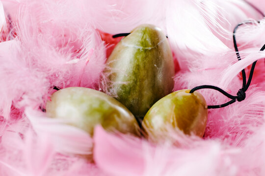 vaginal yoni eggs of different sizes on feathers