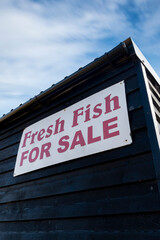 Fresh fish for sale on traditional fishing black hut