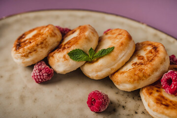 Healthy breakfast, cheese pancakes with raspberry and mint,  copy space