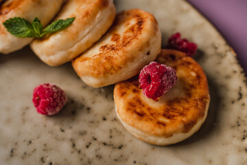 Healthy breakfast, cheese pancakes with raspberry and mint,  copy space