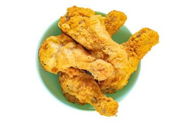 Fried chicken legs in a plate isolated on white background. Classic fast food.