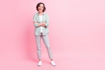 Fototapeta premium Full size portrait of positive candid aged person crossed arms have good mood isolated on pink color background