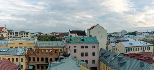 Fototapeta premium Tile roofs over historical city center. Top view of the historic part of Minsk, Belarus.