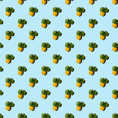 Ripe juicy yellow pears with green leaves on a colored background. Seamless patterns.